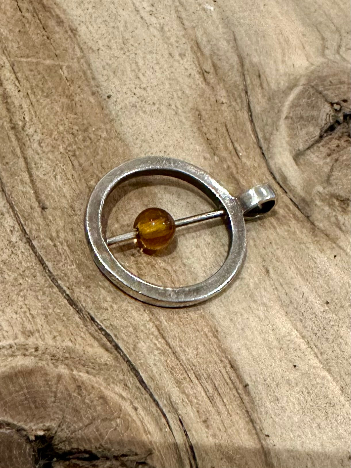 Abstract Circle Moving Orange Stone Silver Pendant